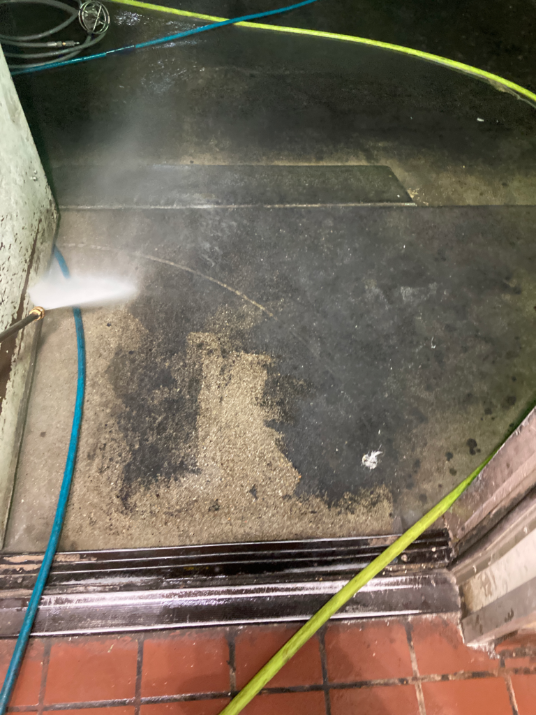 Pressure washing a cement floor
