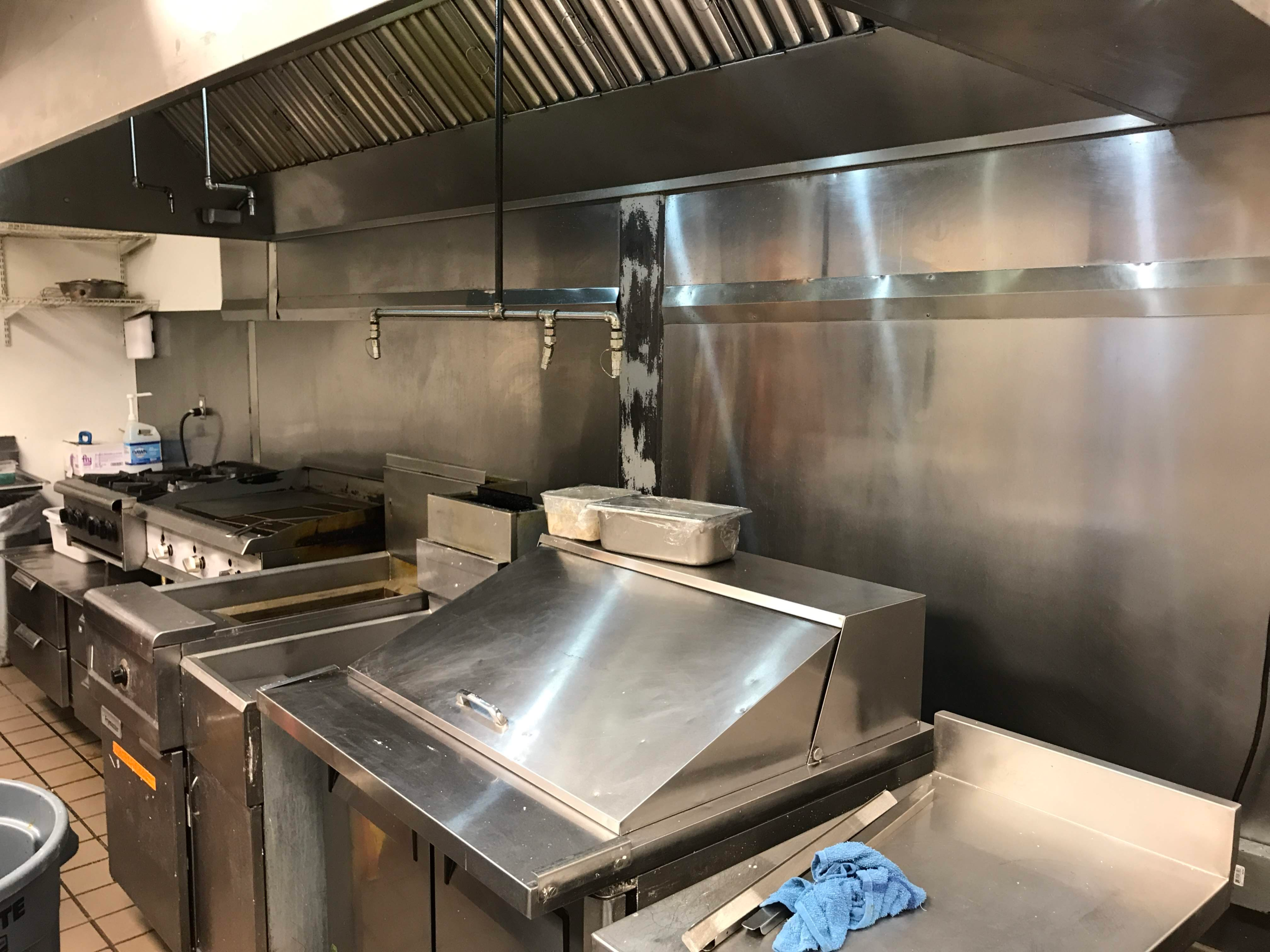 Clean commercial kitchen exhaust hood after professional cleaning