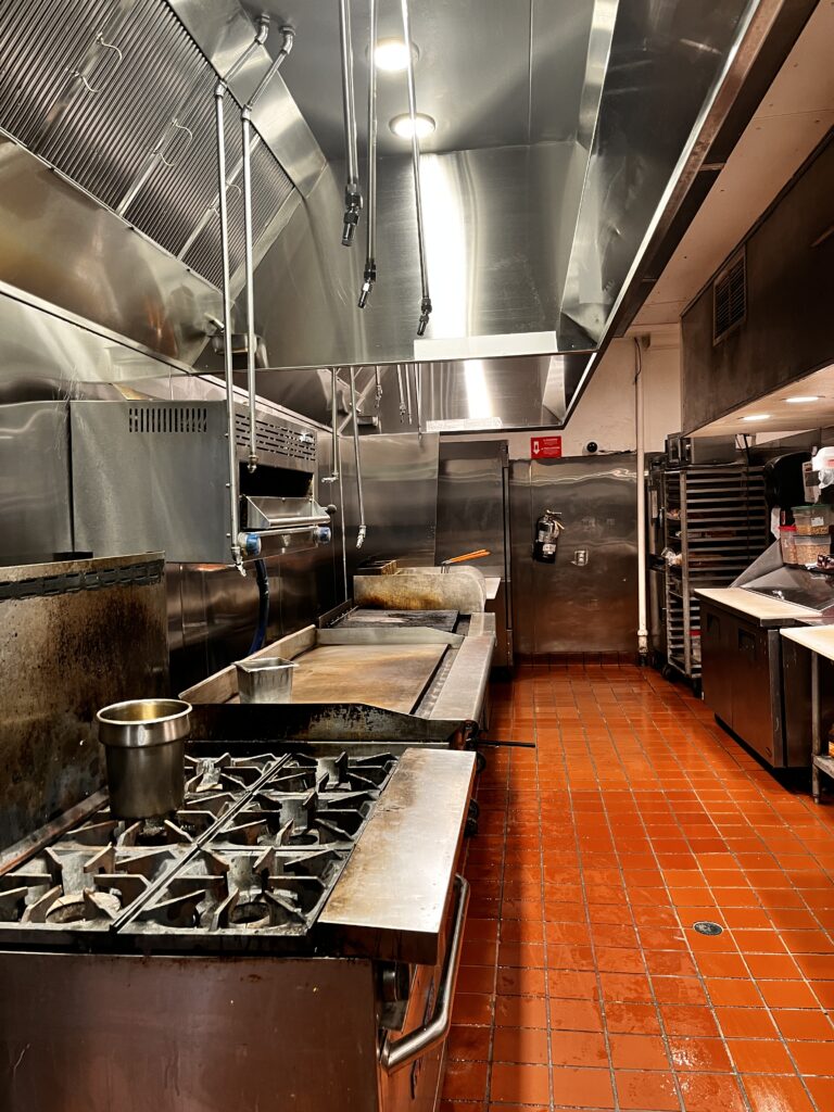 Commercial hood system cleaned inside restaurant kitchen
