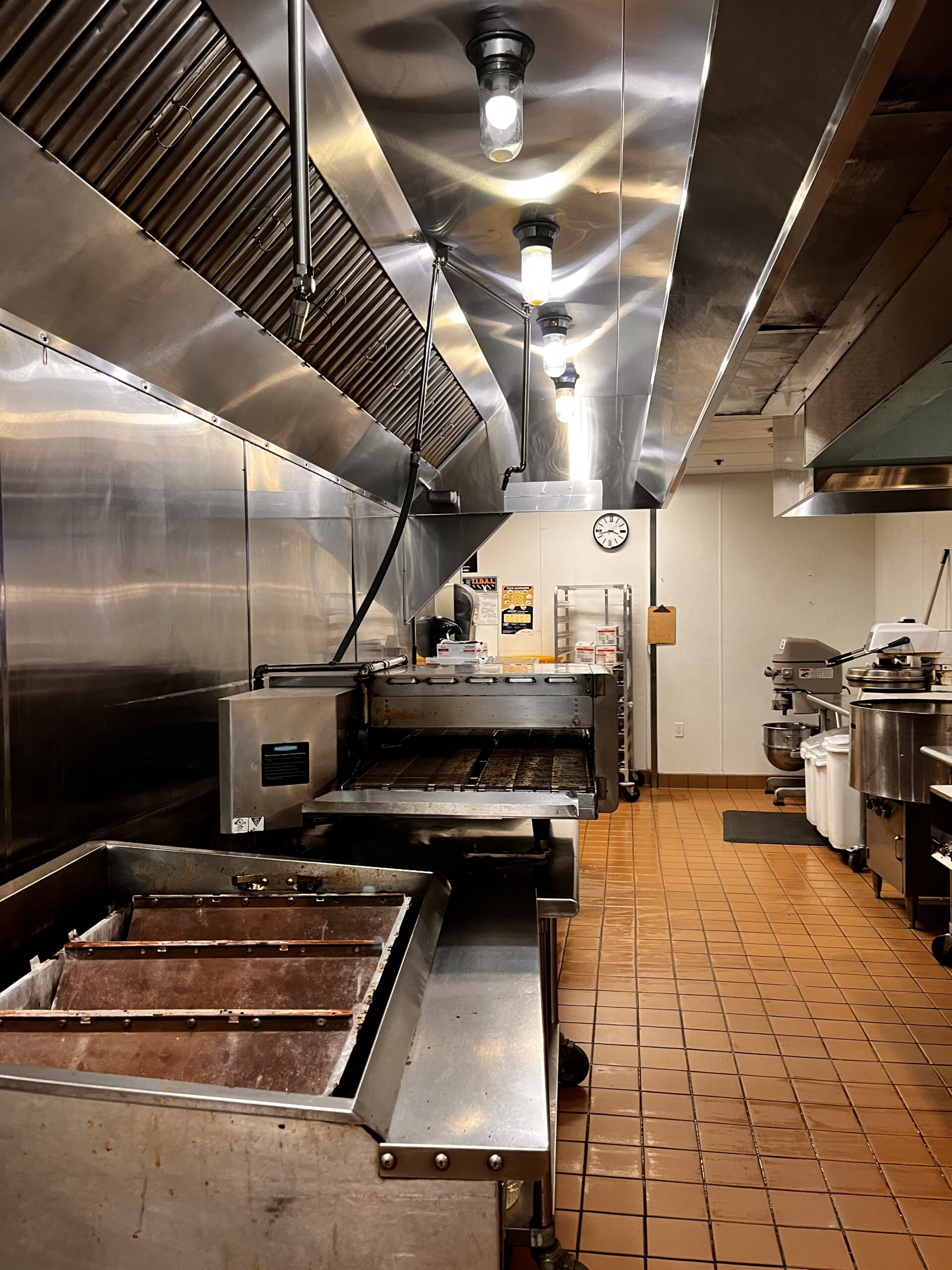 Shiny stainless steel hood after professional cleaning