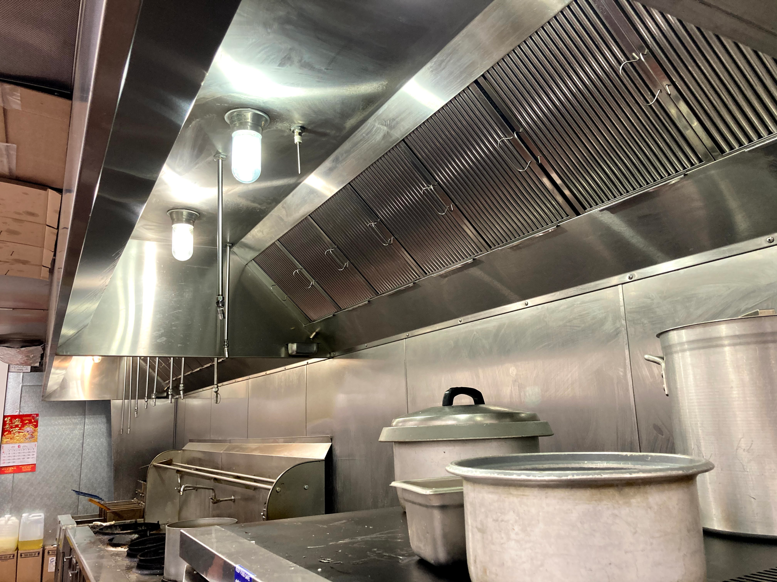 Commercial kitchen hood cleaned for fire code compliance
