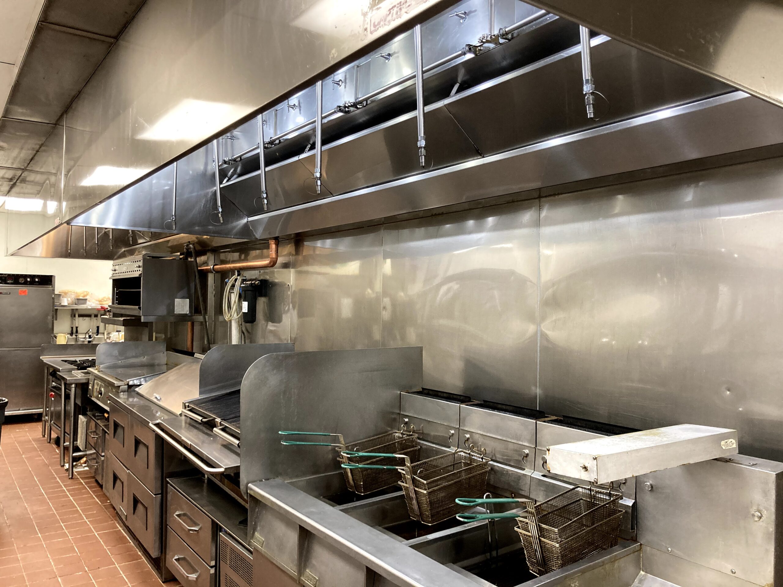 Stainless steel kitchen hood free of grease buildup
