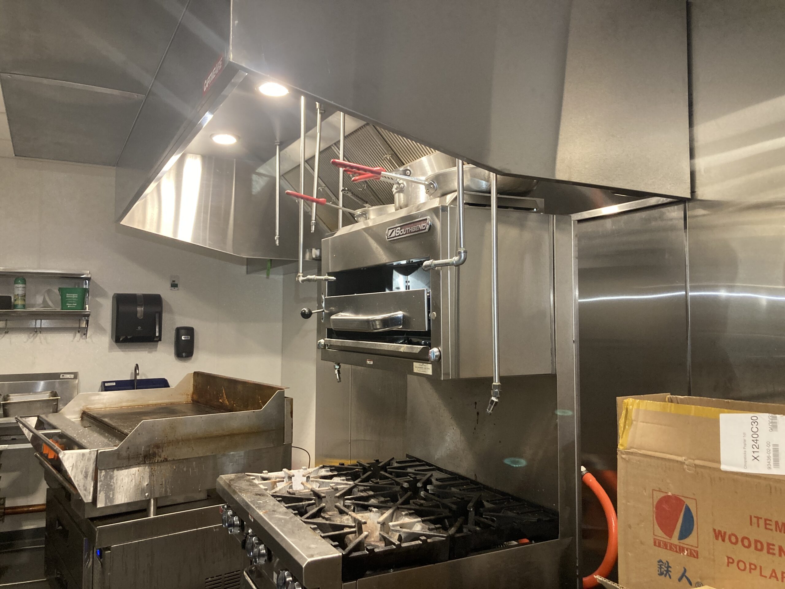 Restaurant exhaust hood cleaned by certified professionals